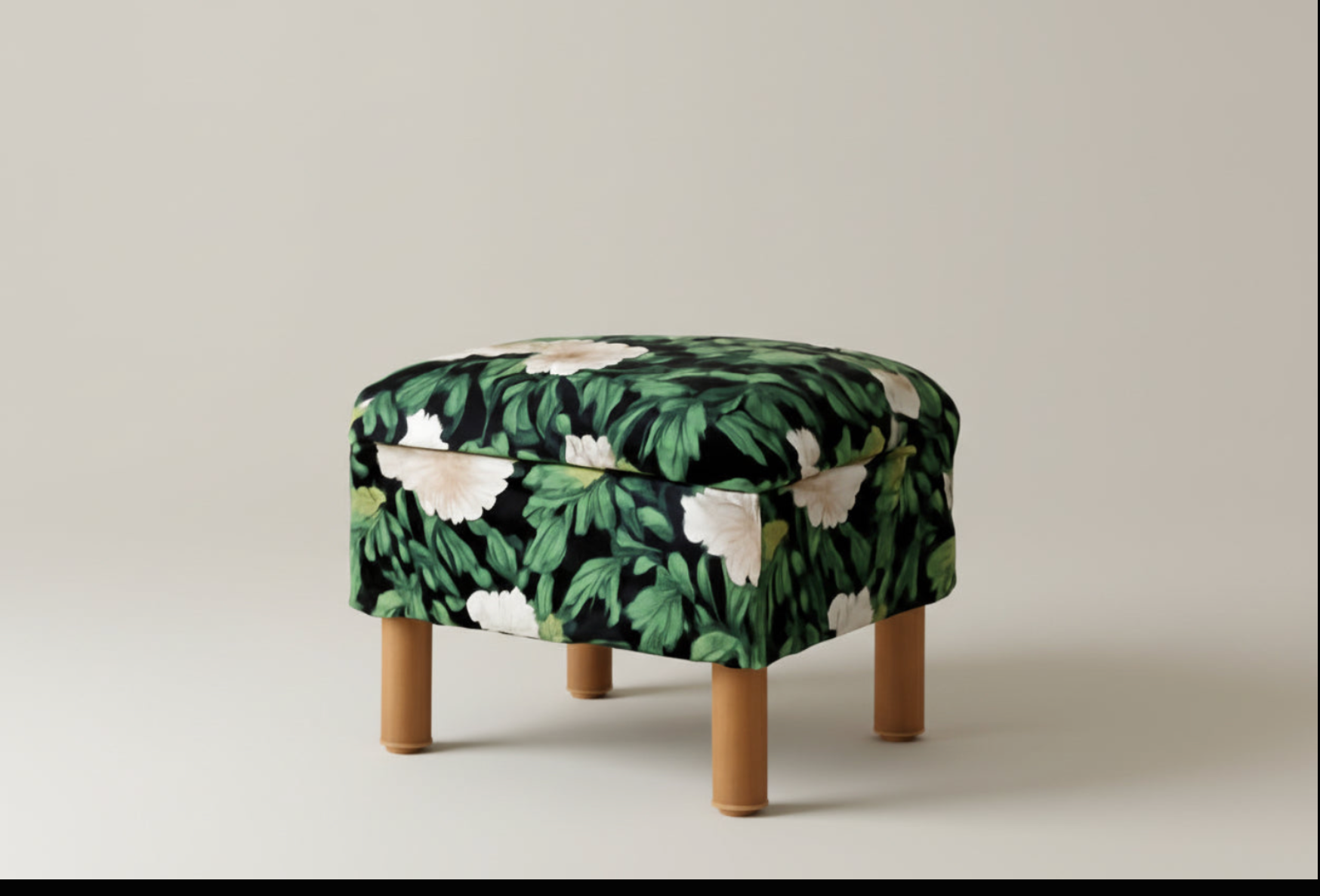 Stool with leaf-patterned cover on a plain background