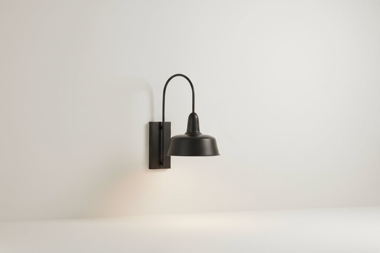 Black wall-mounted outdoor light fixture on a white background
