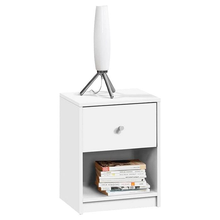 White nightstand with a drawer and open shelf holding books, topped with a white lamp.