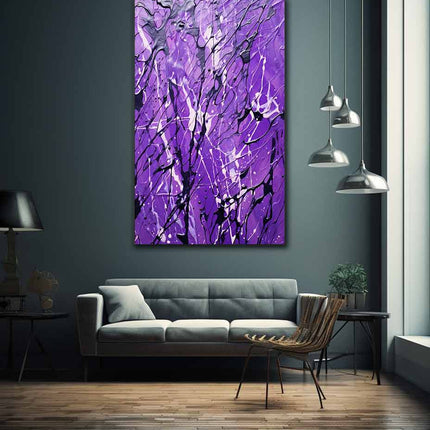 Modern living room with a gray sofa, abstract purple painting, and pendant lights.