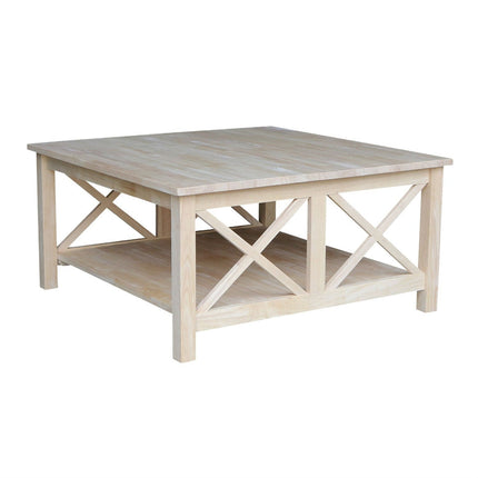 Light wood coffee table with X-brace design on a white background