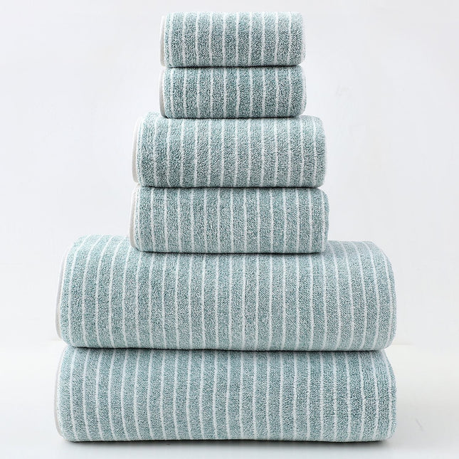 Stack of six striped towels on a light gray background