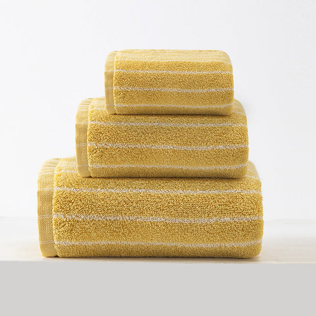 Stack of yellow striped towels on a white background
