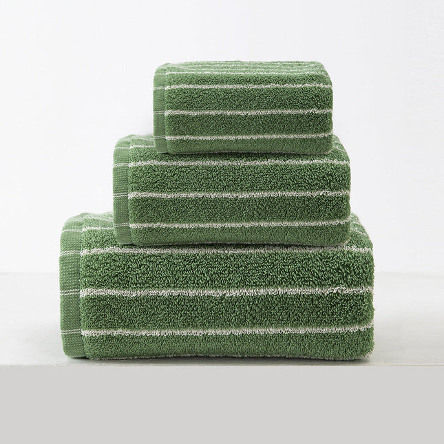 Set of green striped towels on a white background