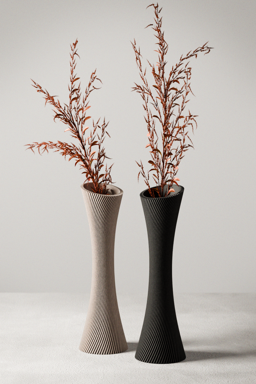 Two vases, one beige and one black, with dried plants on a light gray background