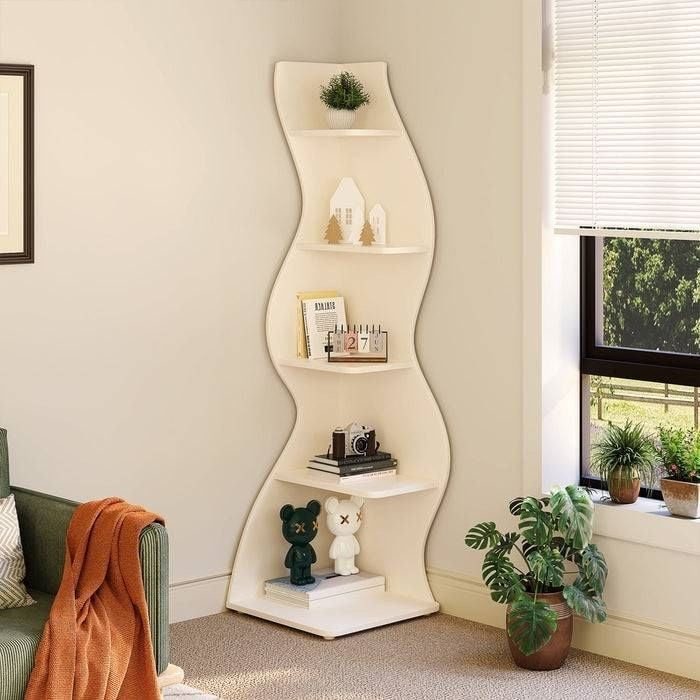 Wavy white shelf with decorative items in a room with a window and plant.