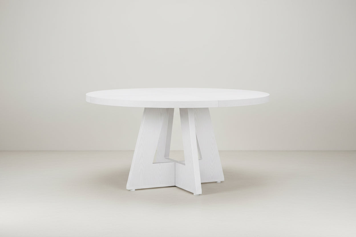 White round table with a minimalist design on a white background