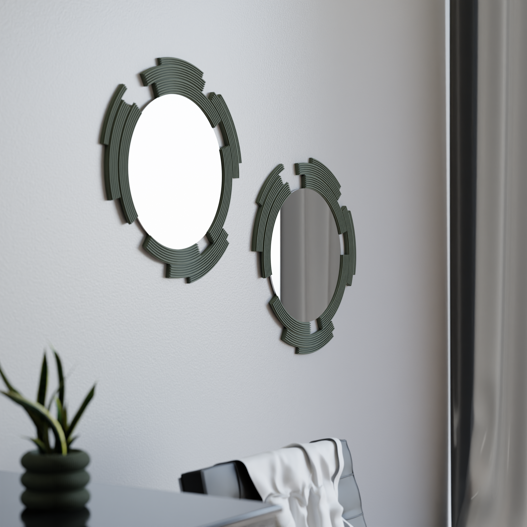 Two decorative mirrors with geometric frames on a white wall.