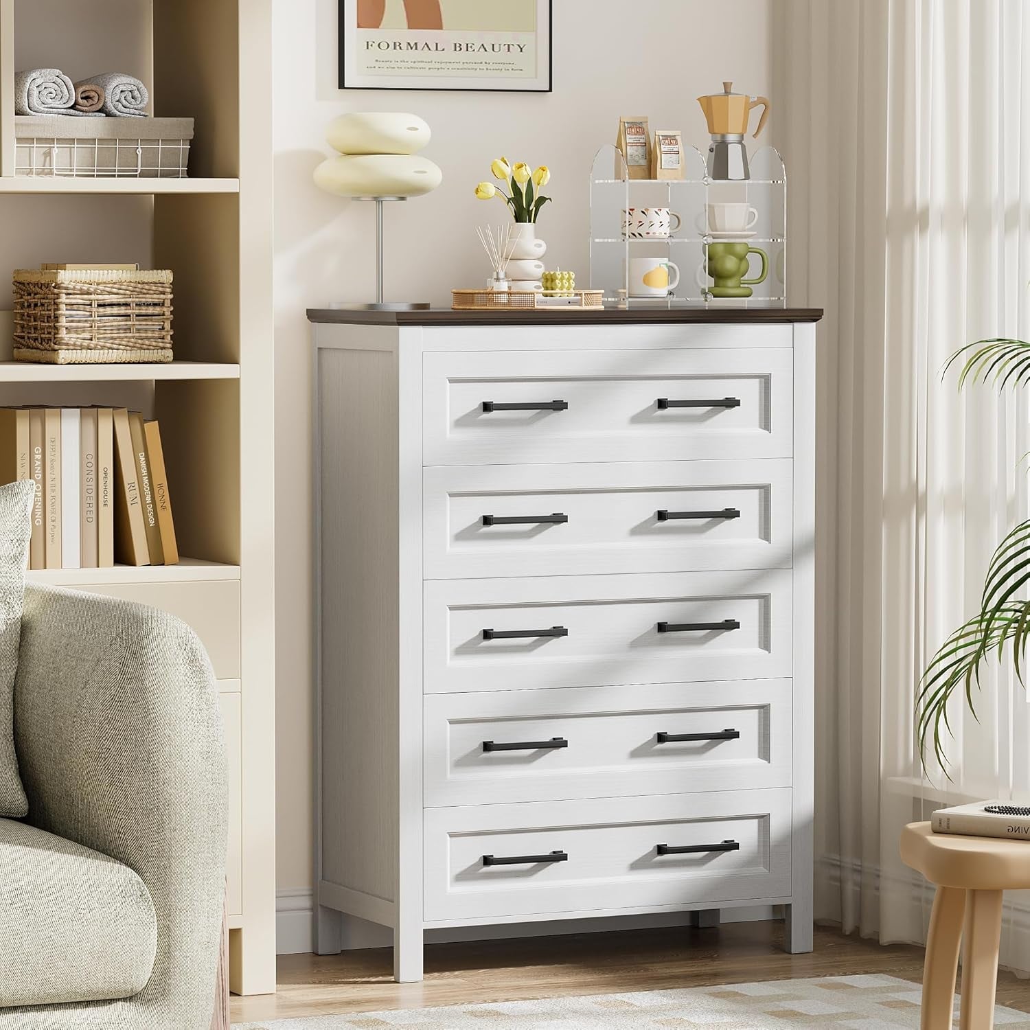 White dresser with black handles in a living room setting