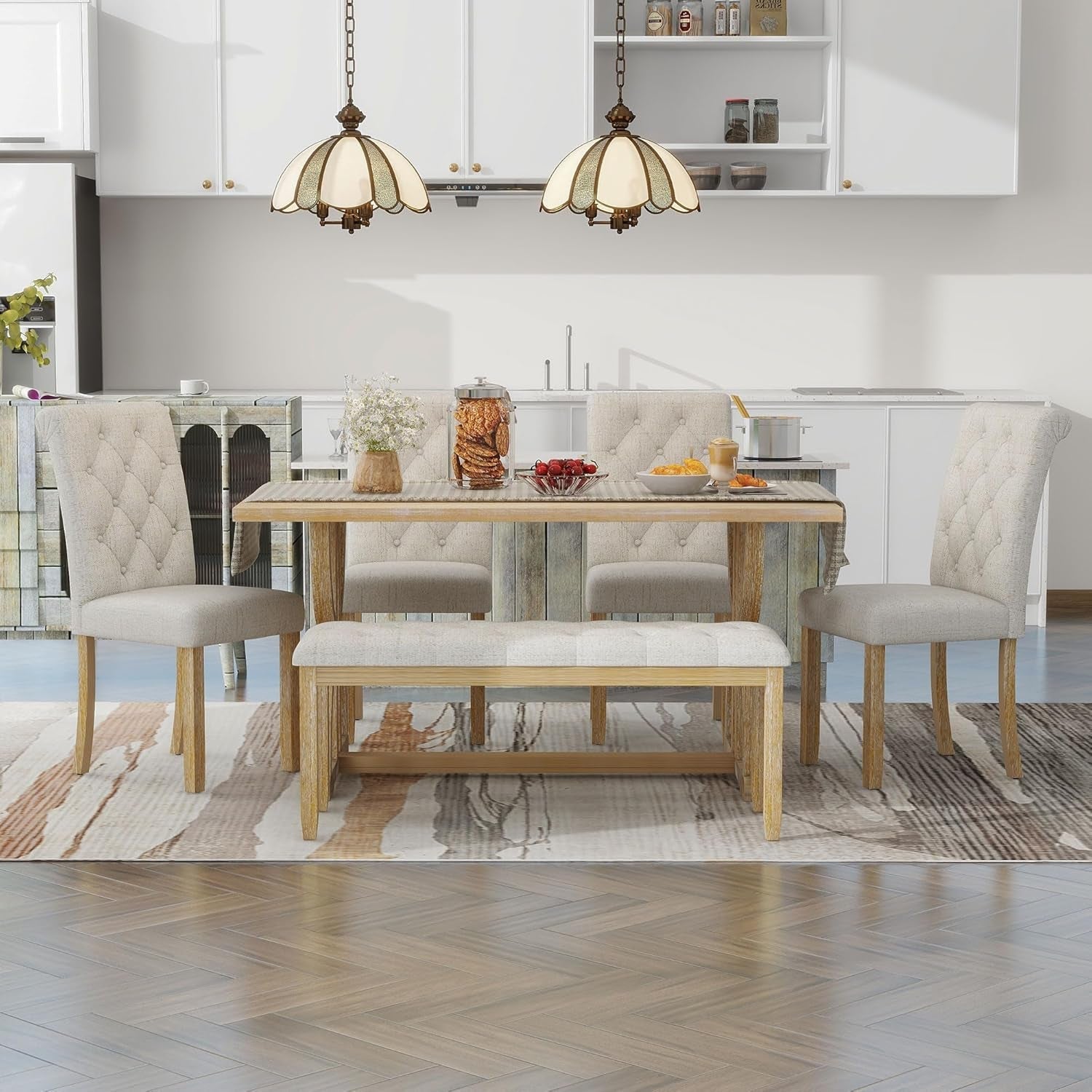 Dining room with a wooden table and chairs in a modern kitchen setting.