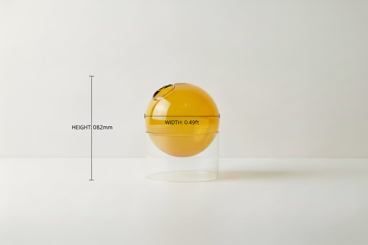 Glass container with an orange spherical object inside, showing dimensions on a white background.