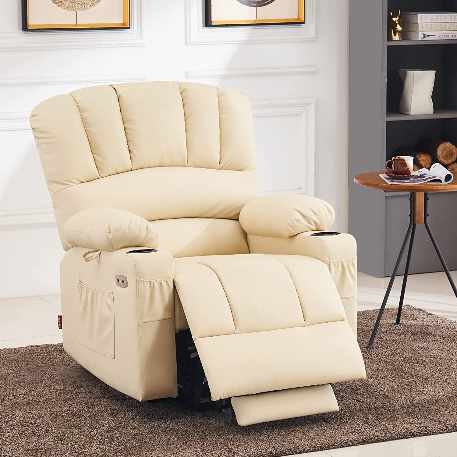 Beige recliner chair in a living room setting with a small table and decor items.