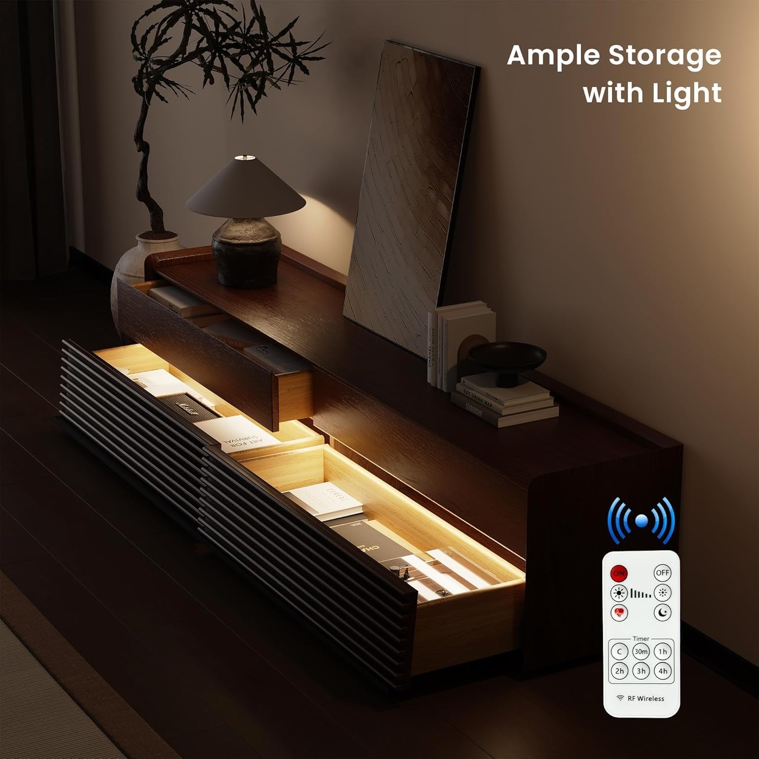 Modern entertainment console with lighted storage compartments and remote control in a dimly lit room.