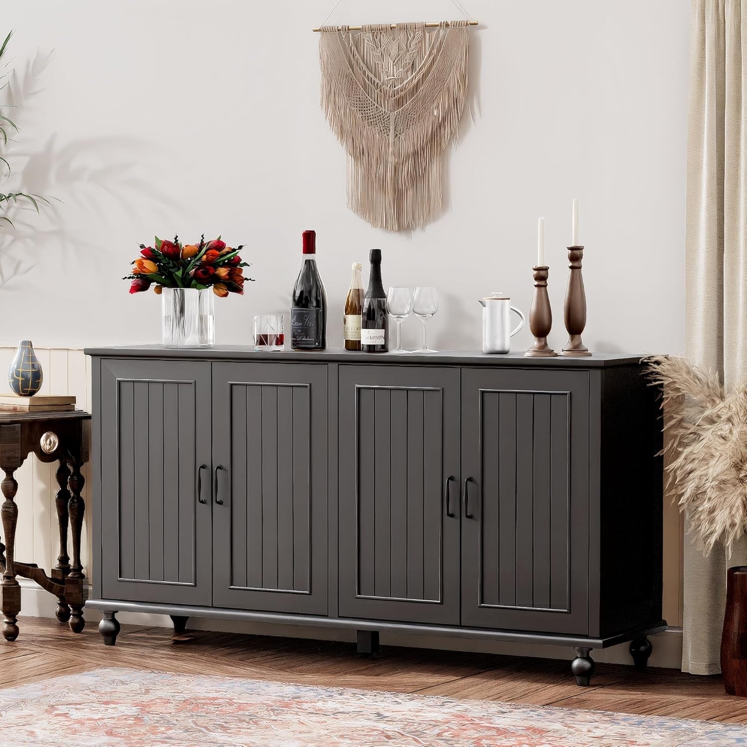 Dark gray sideboard with decorative items in a living room setting