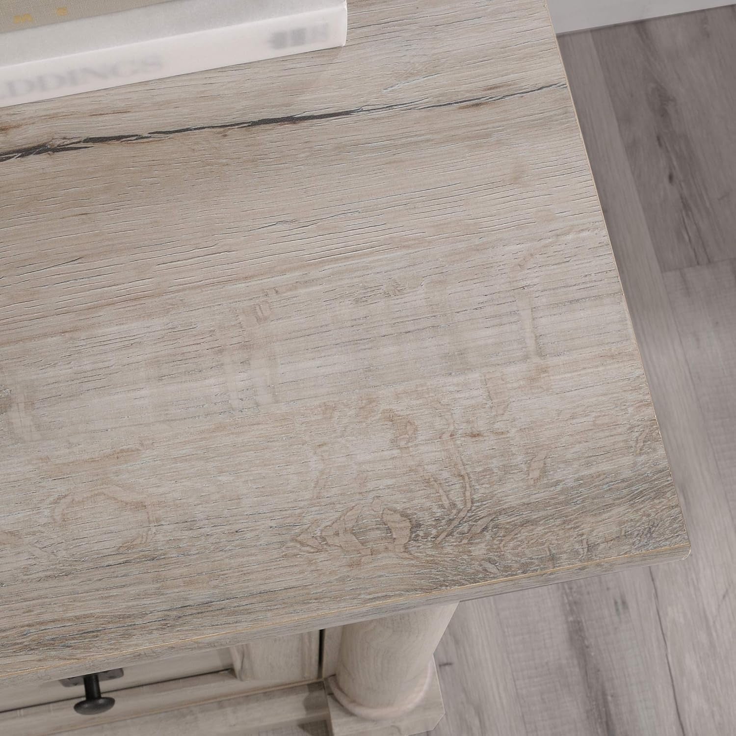 Close-up of a wooden desk surface with a marble finish.