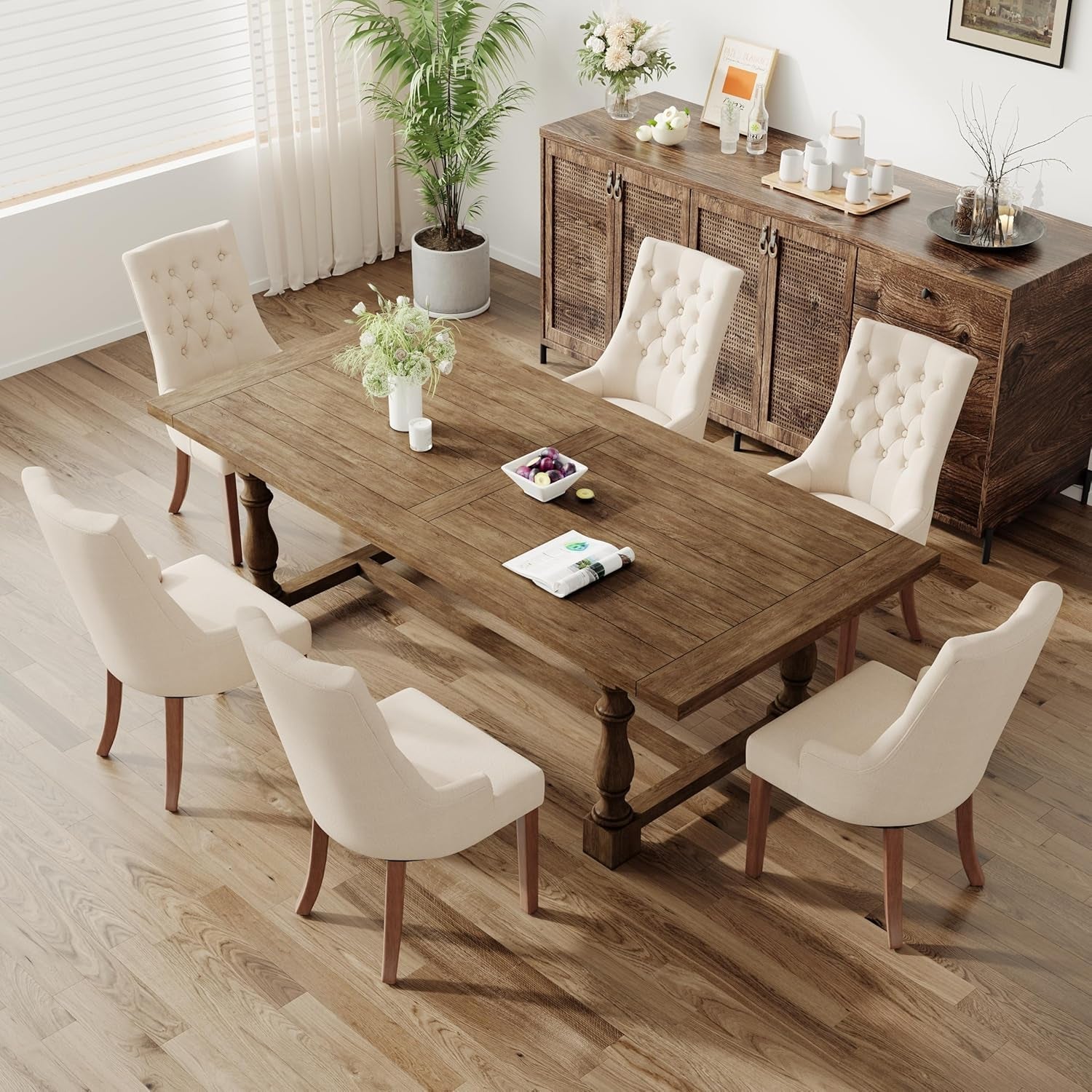 Dining room with wooden table and chairs in a well-lit room.