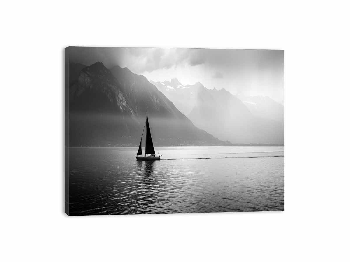 Sailboat on a calm lake with mountains in the background