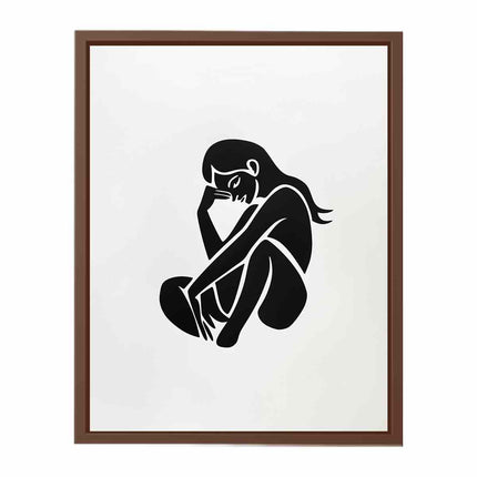 Framed artwork of a black silhouette of a person sitting with a hand on their face against a white background.