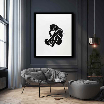 Framed black and white artwork of a sitting figure in a modern living room.