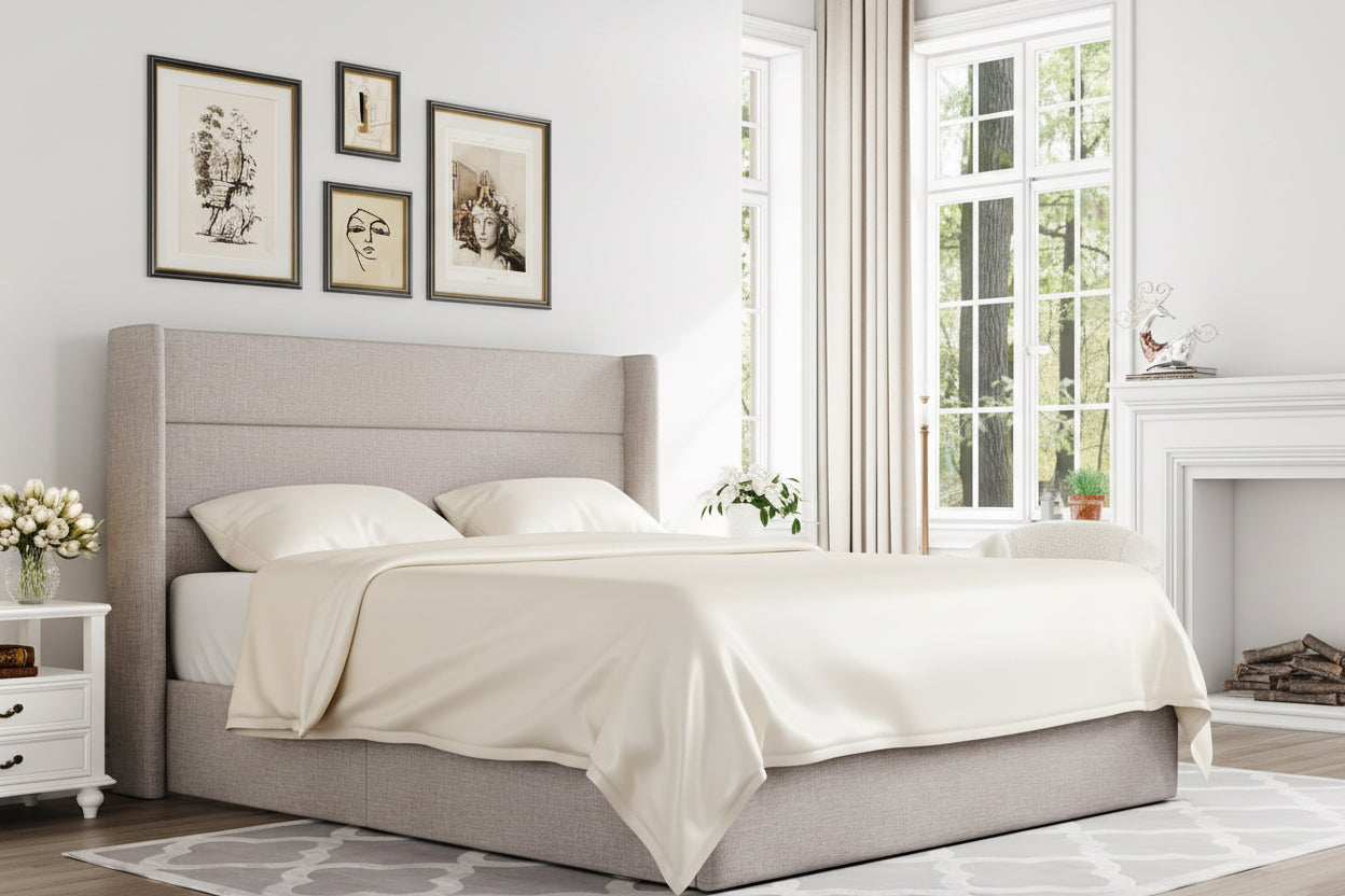 Gray upholstered bed with lift mechanism in a bedroom setting