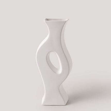 White ceramic vase on a light gray background
