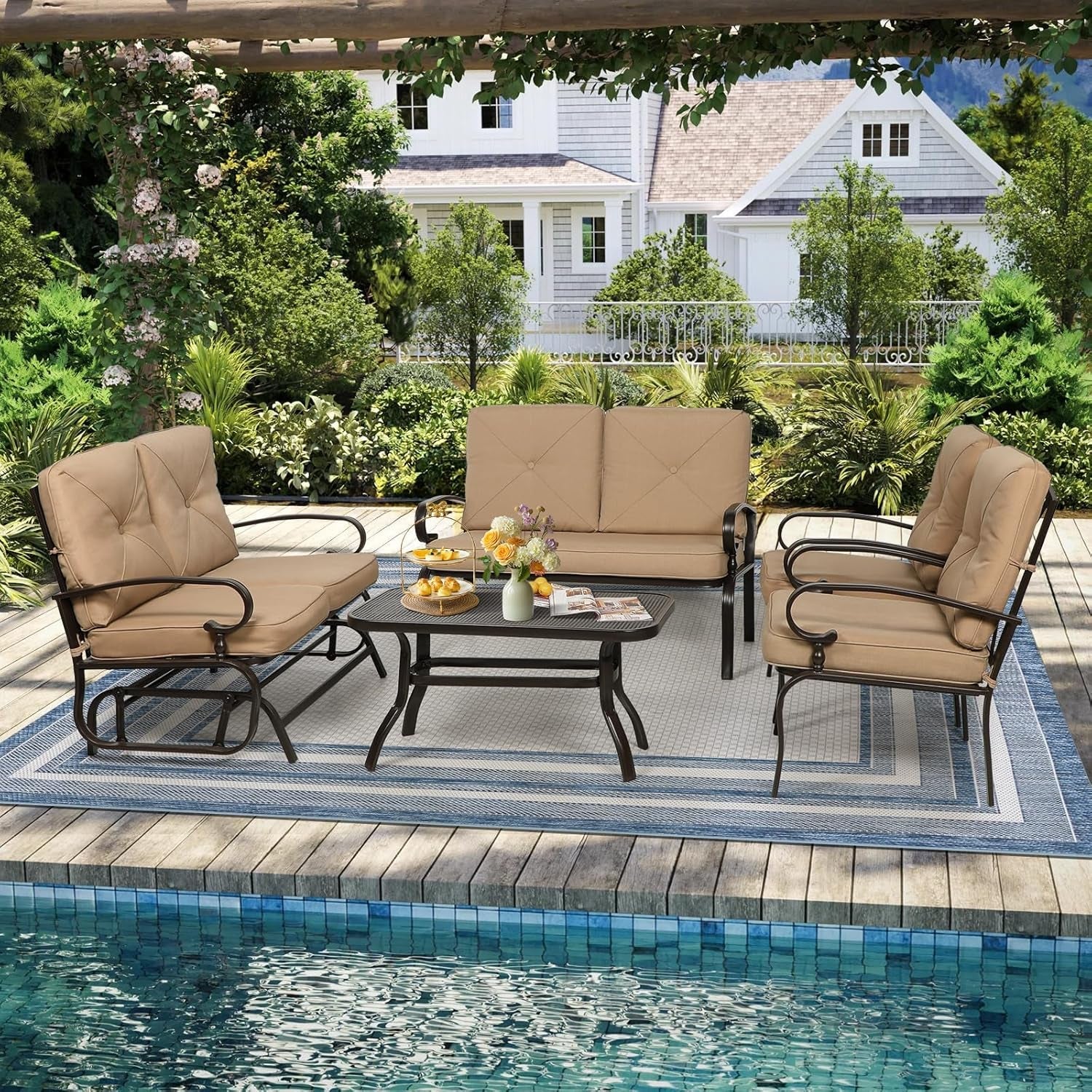 Outdoor patio set with beige cushions by a poolside