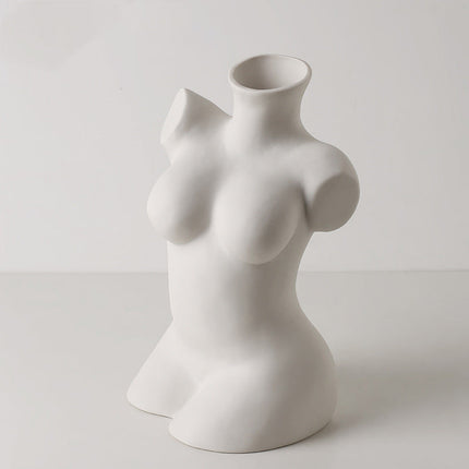 White ceramic torso-shaped vase on a light gray background