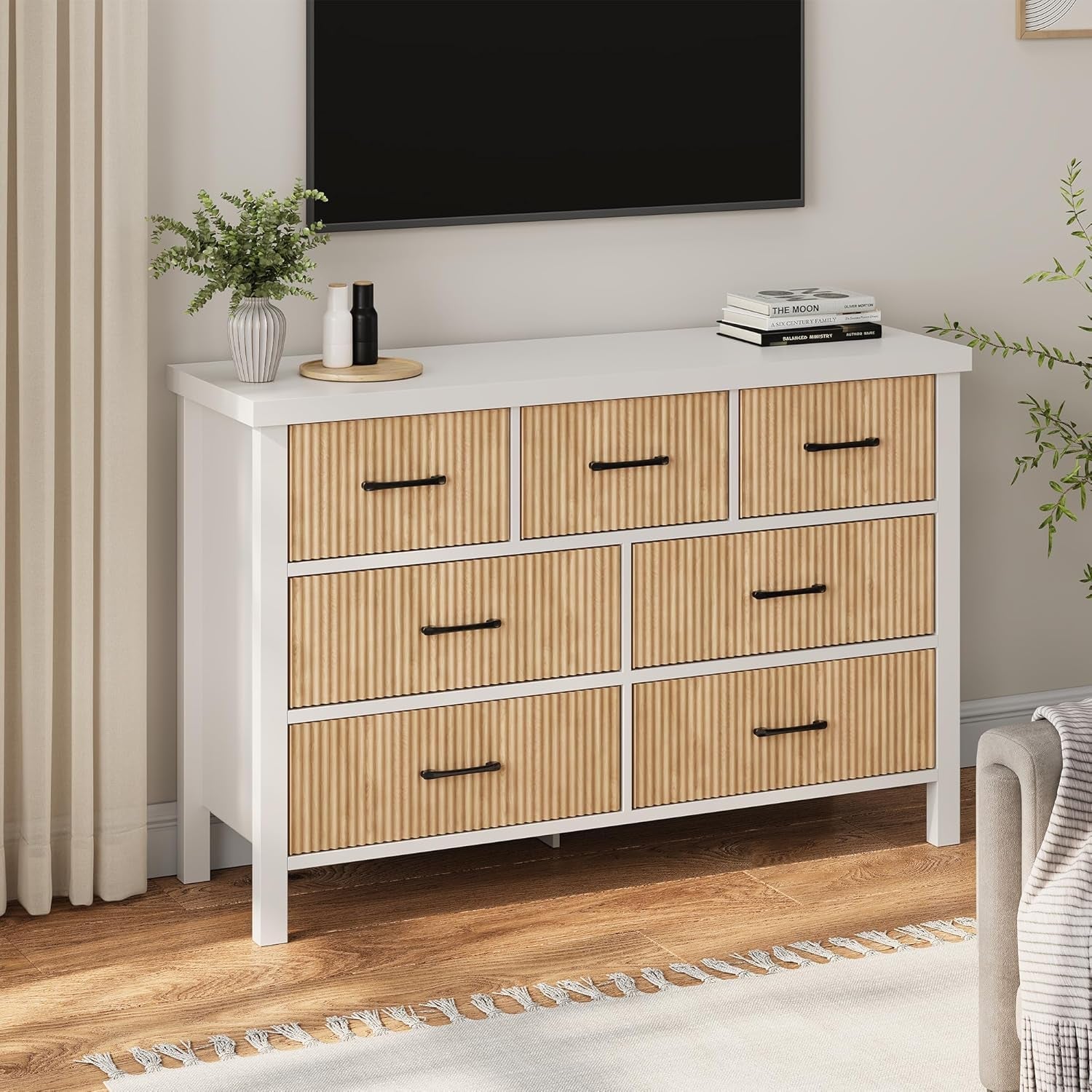Wooden dresser with white top in a room setting