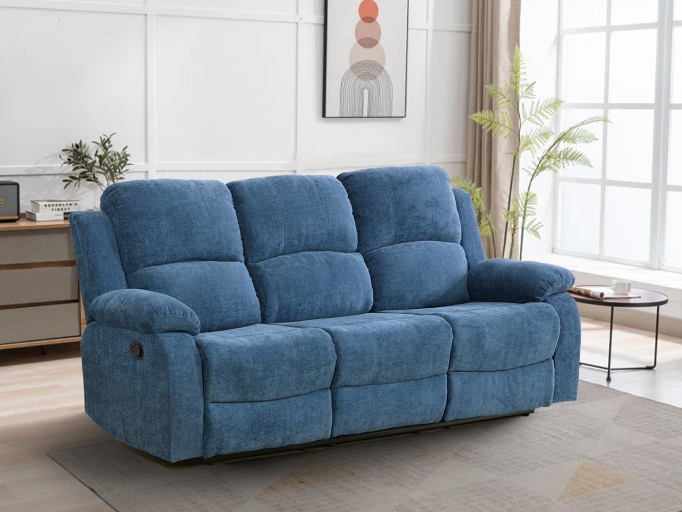 Blue sofa in a living room setting with a neutral color palette