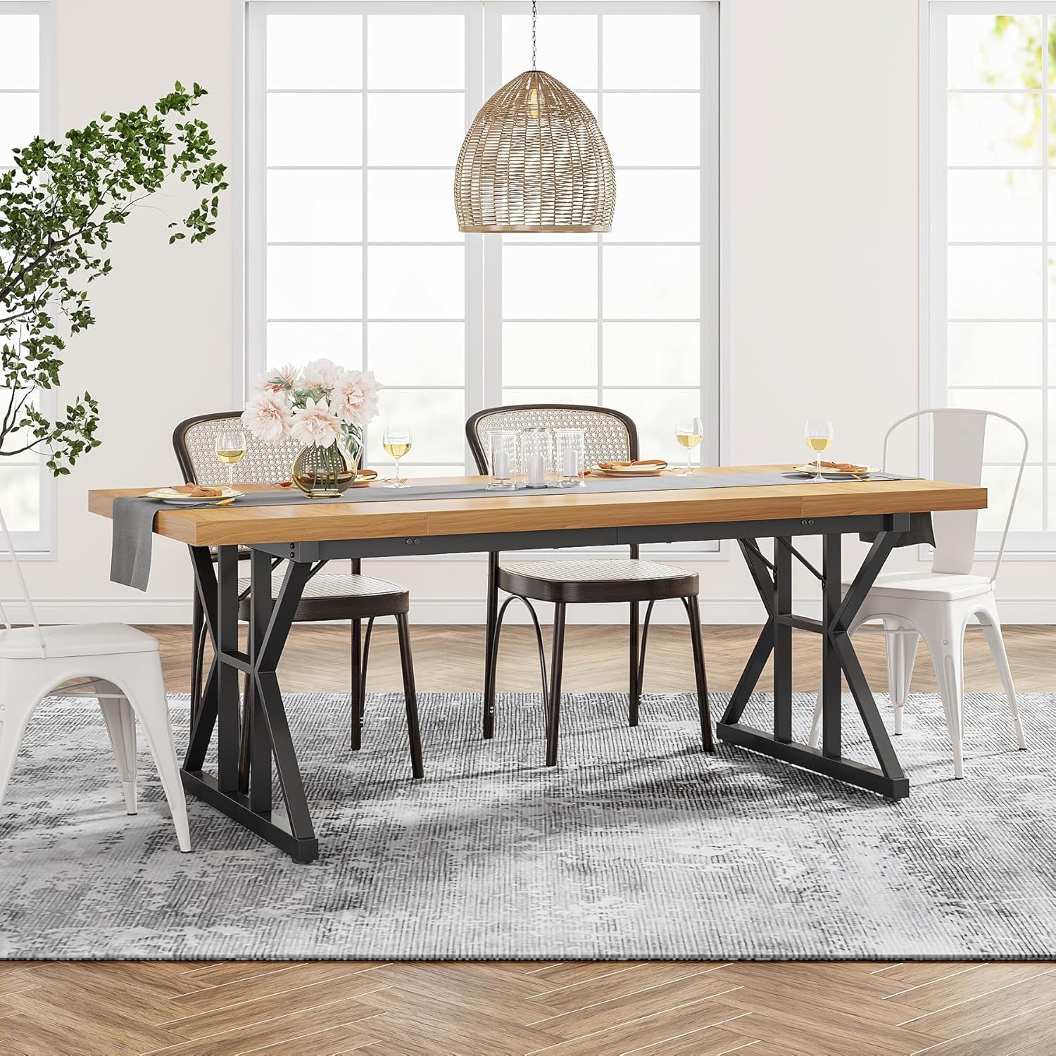 Dining room with a wooden table and chairs in a bright room.
