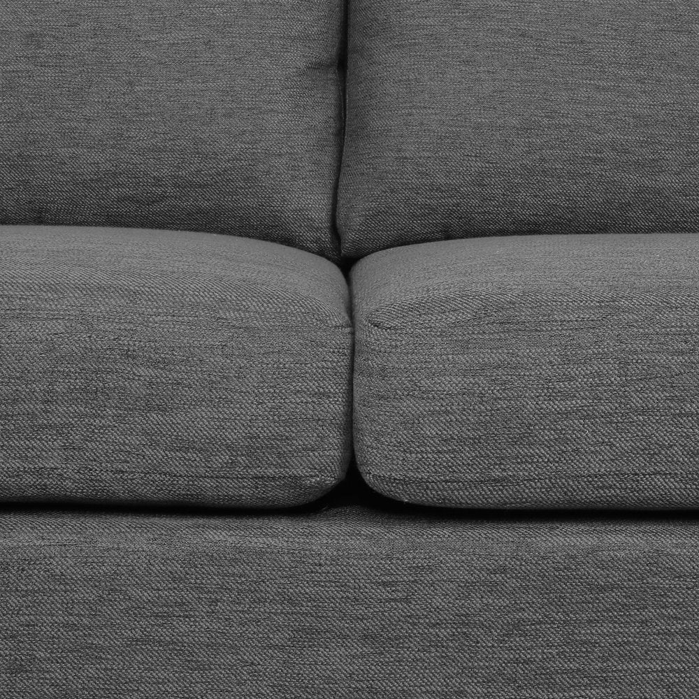 Gray fabric sofa with a close-up view of the cushions.