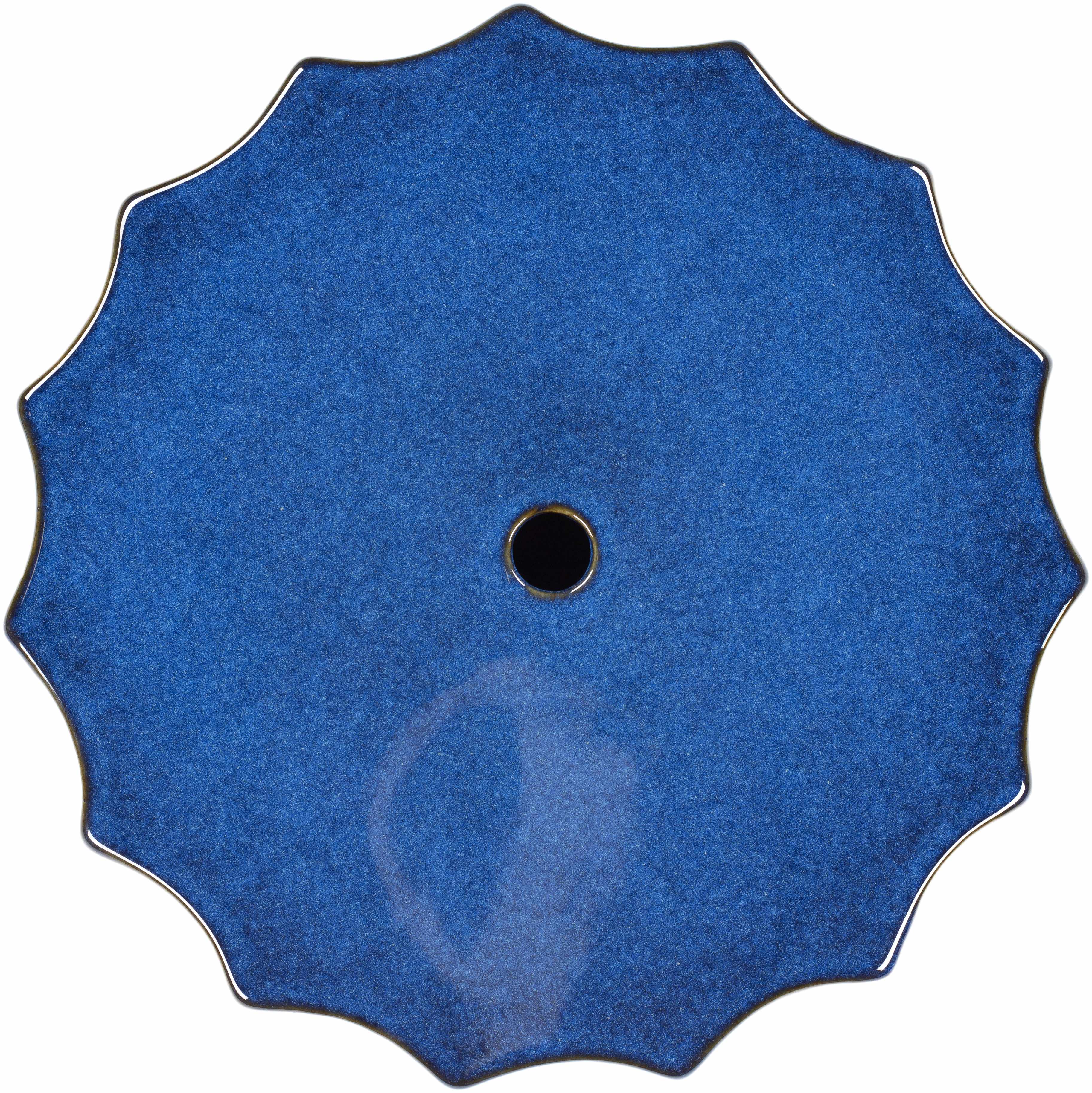 Blue circular object with a central black dot on a white background