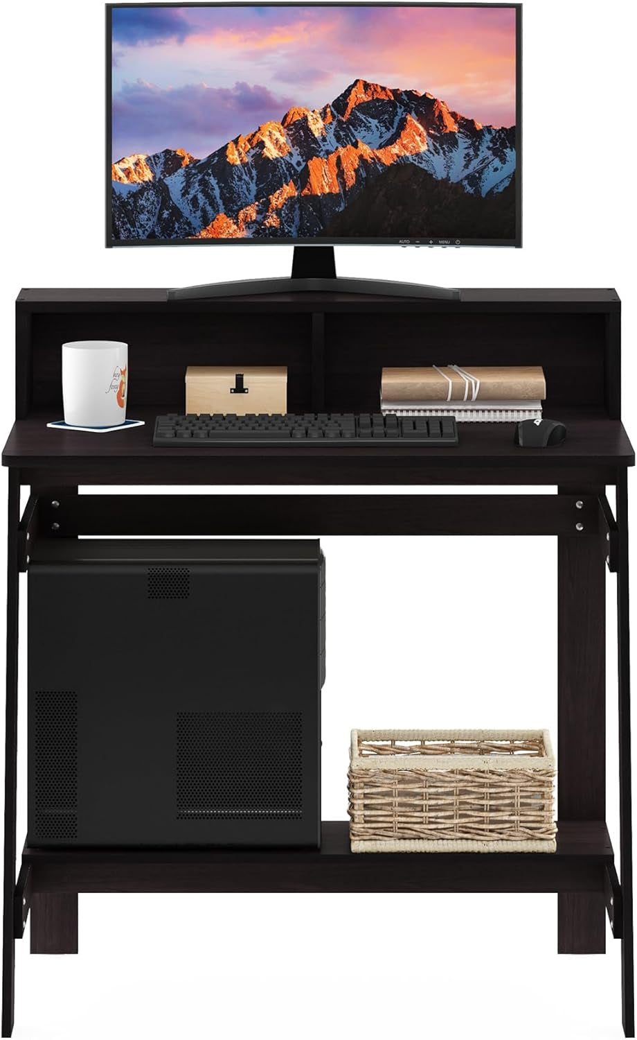 Black corner desk with computer setup including a monitor, keyboard, mouse, and decorative items.