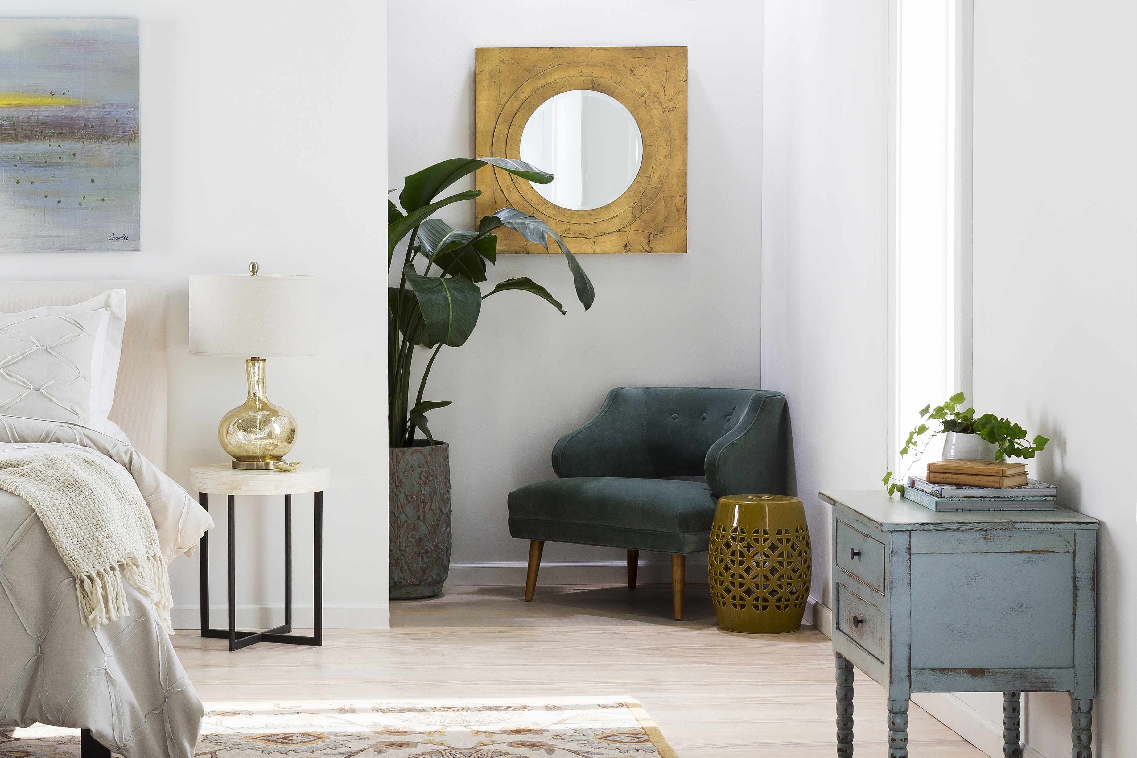 Modern bedroom with a bed, rug, and decorative items.