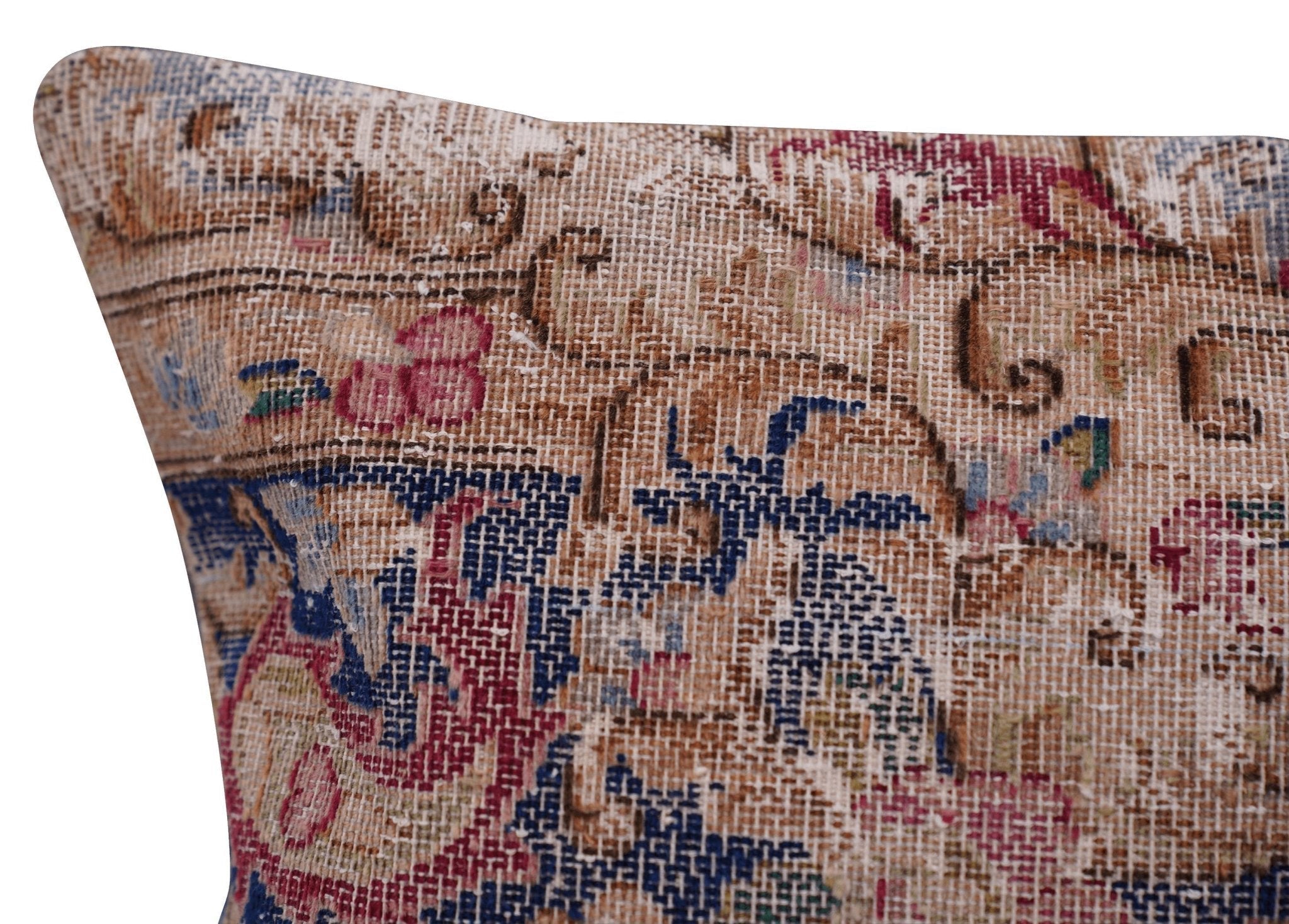 Close-up of a textured fabric with intricate patterns and colors on a white background