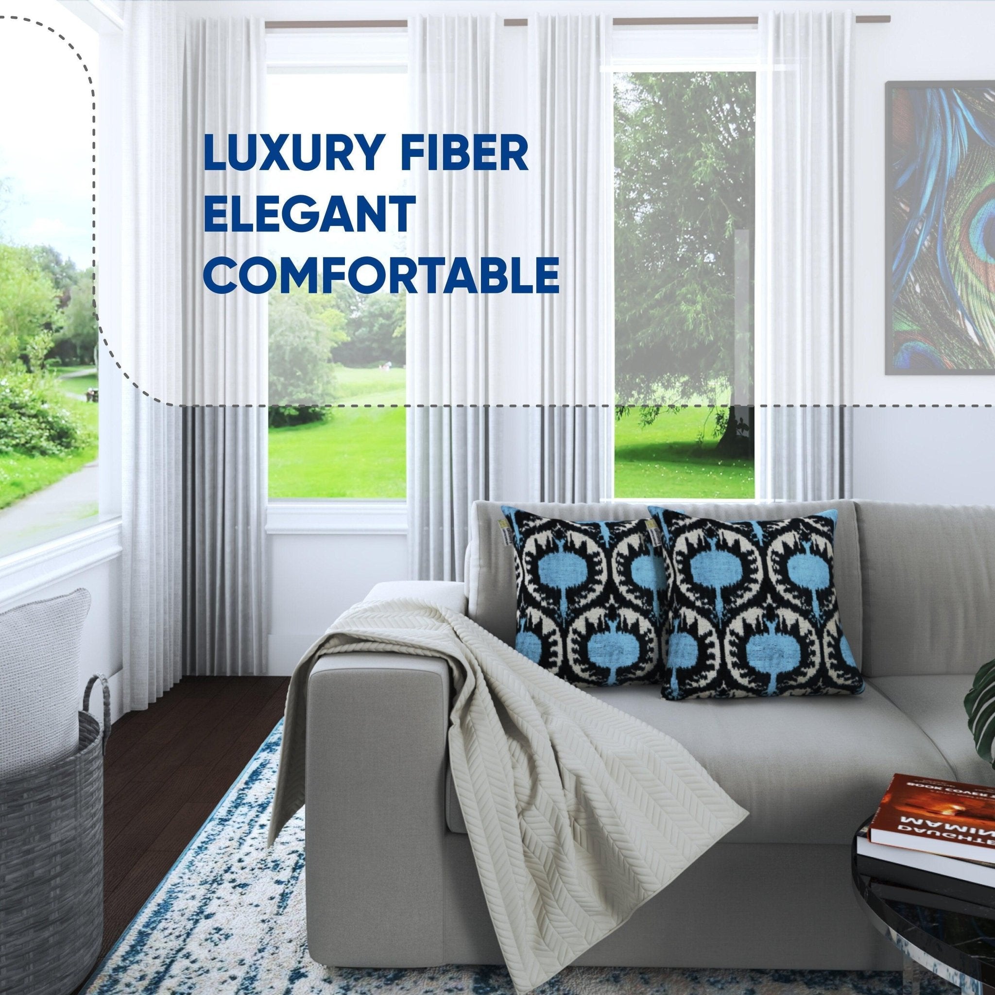 Living room with a gray sofa, patterned cushions, and a view of greenery outside.