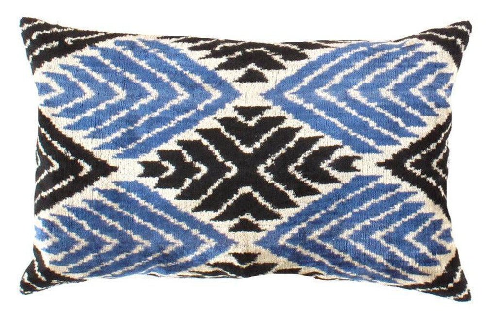 Decorative pillow with blue and black geometric pattern on a white background