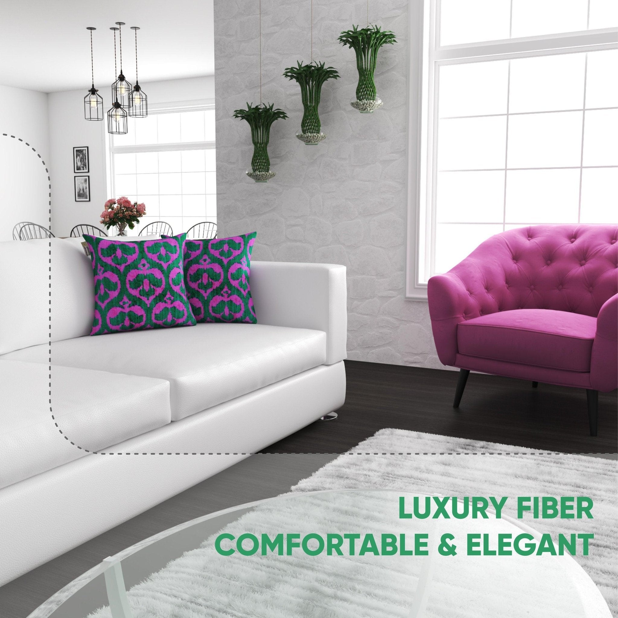Modern living room with a white sofa, pink armchair, and decorative pillows.
