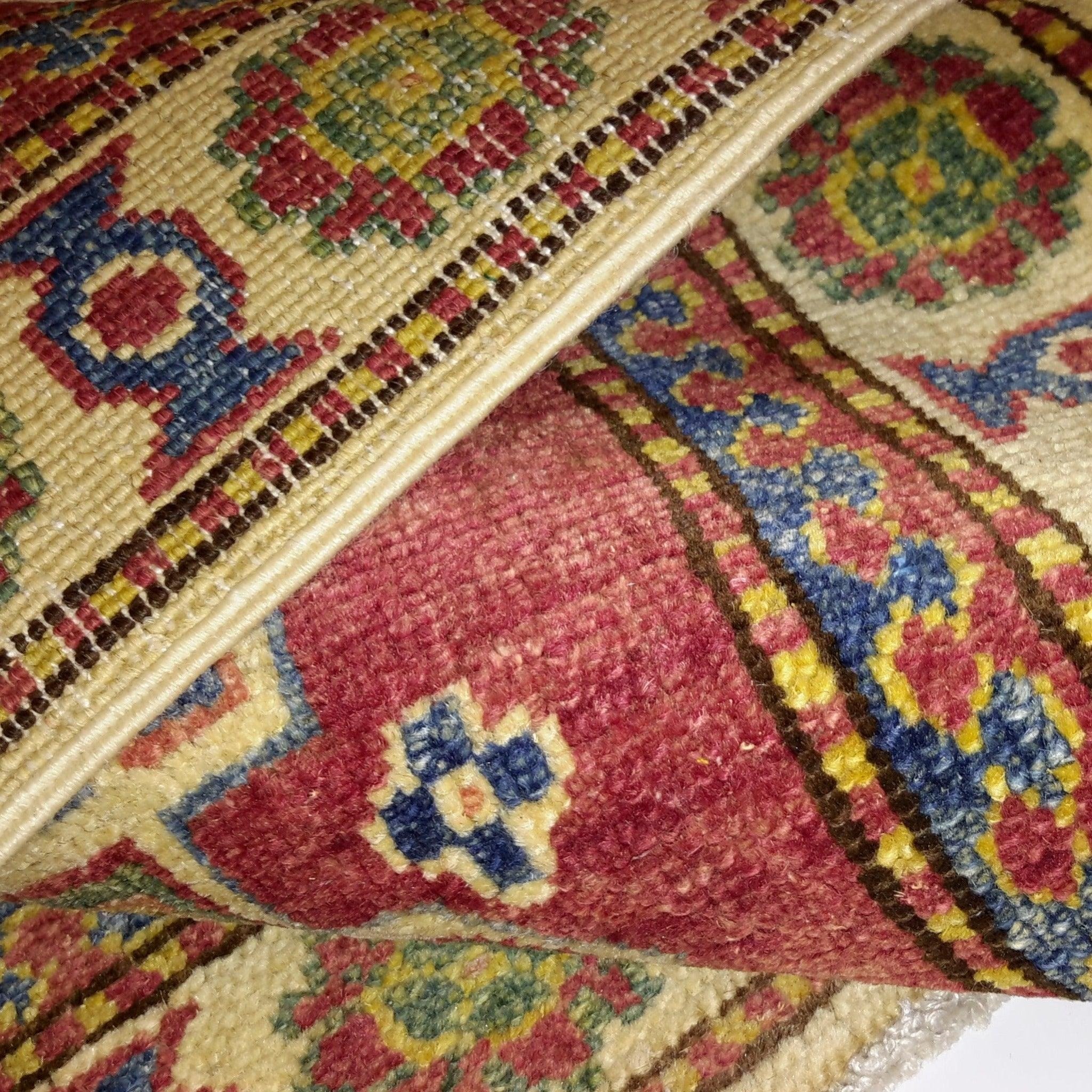 Close-up of a colorful patterned rug with intricate designs.
