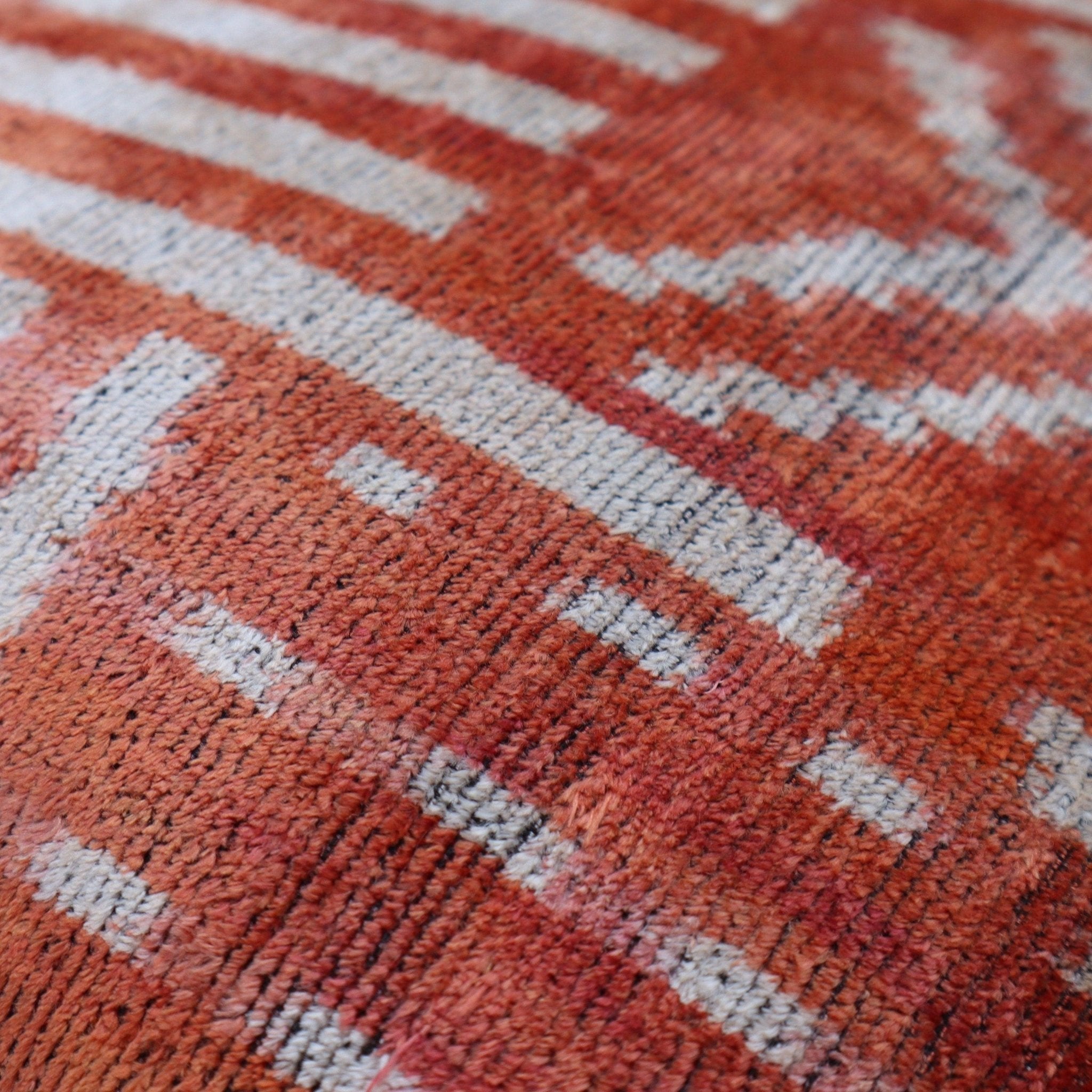 Close-up of a textured red and white patterned fabric