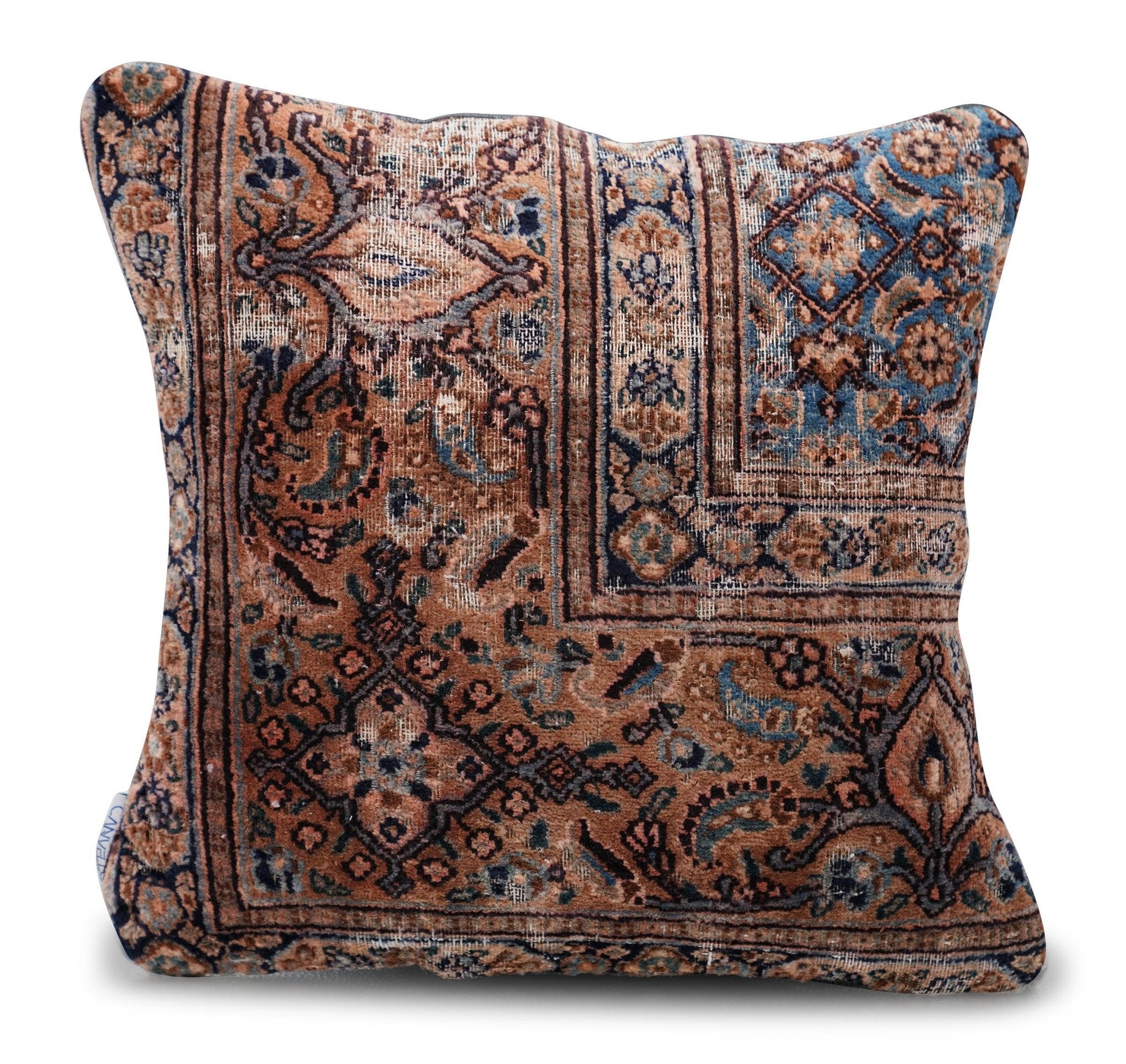 Decorative pillow with intricate paisley pattern on a white background