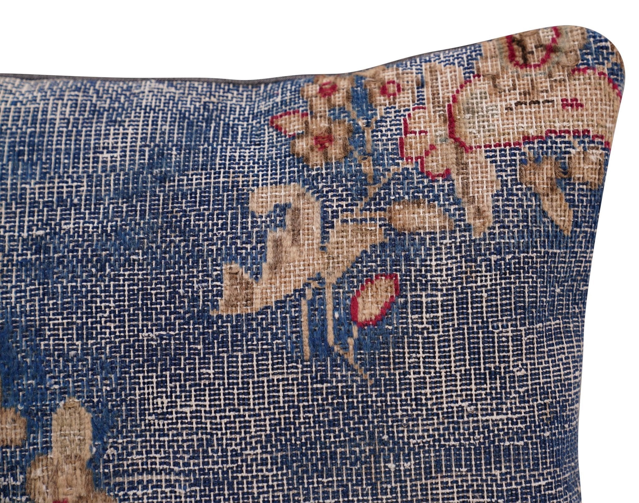 Decorative pillow with floral patterns on a blue background