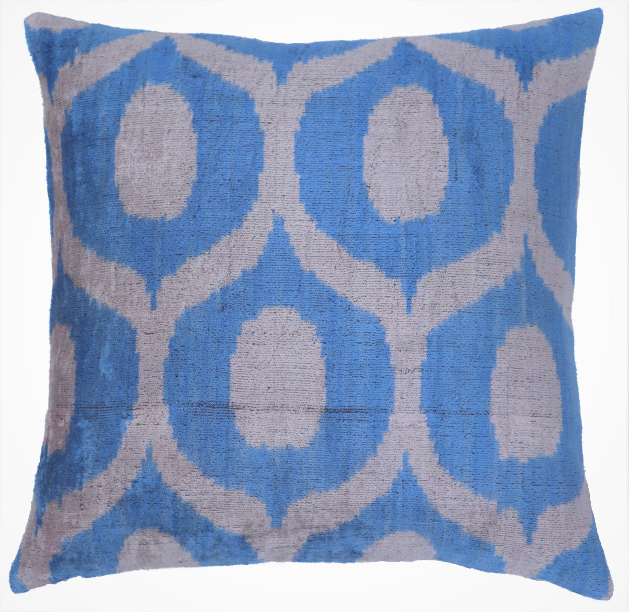 Blue and gray patterned pillow on a white background