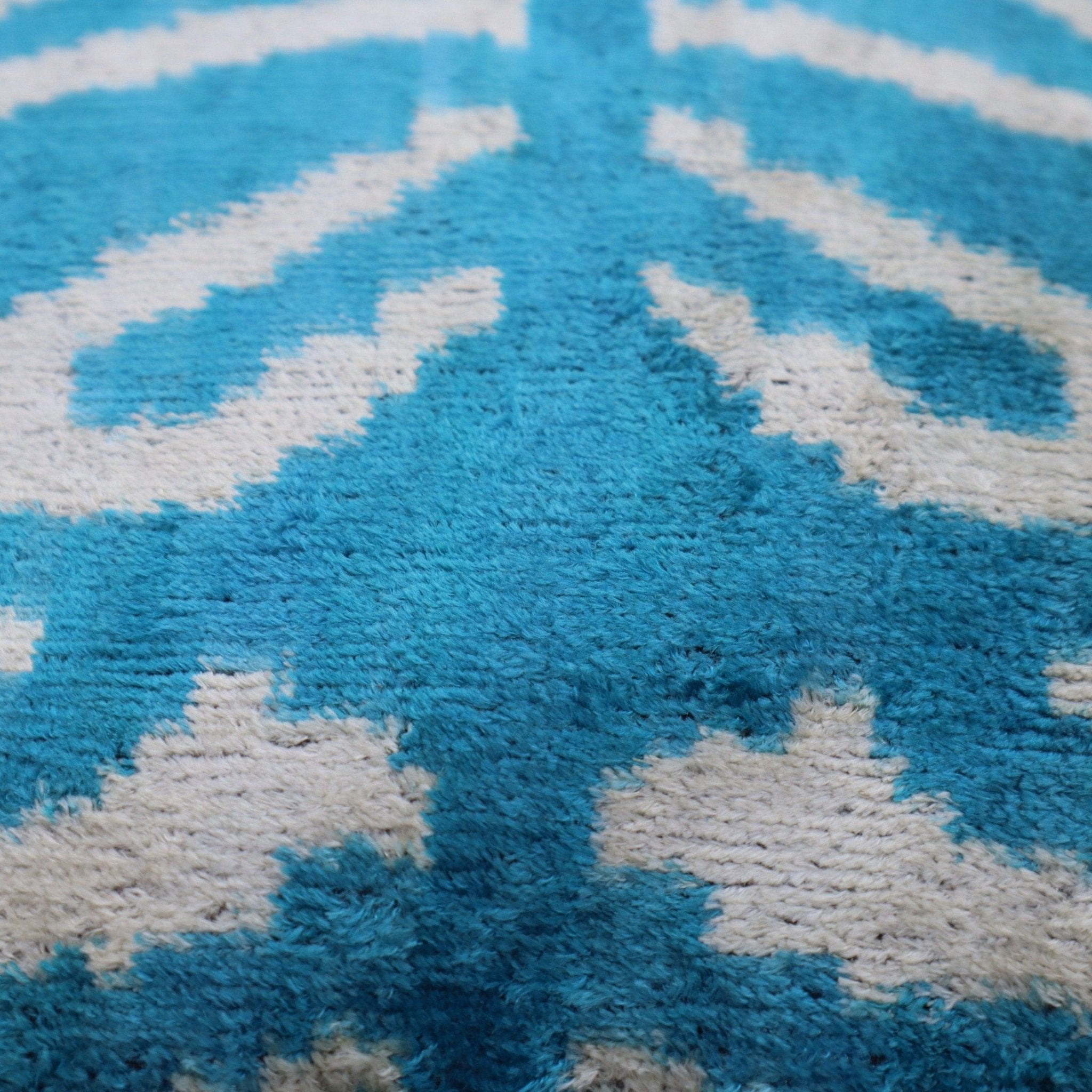 Close-up of a blue and white patterned rug