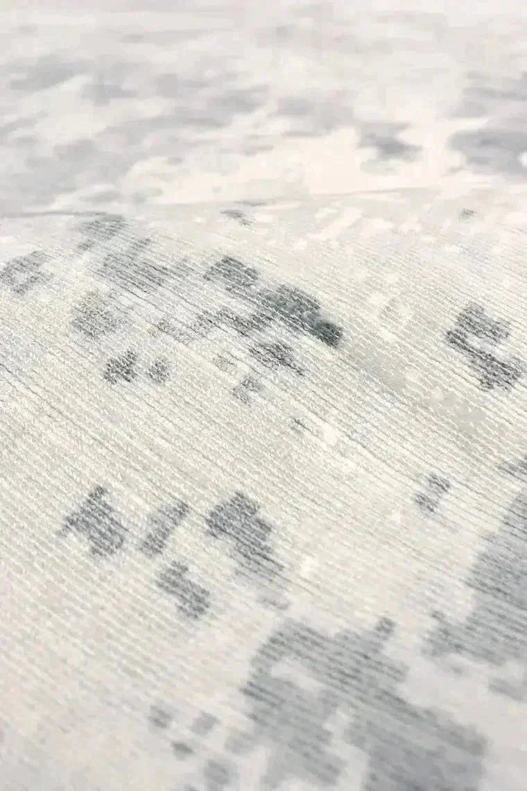 Close-up of a textured fabric with a pattern on a light background
