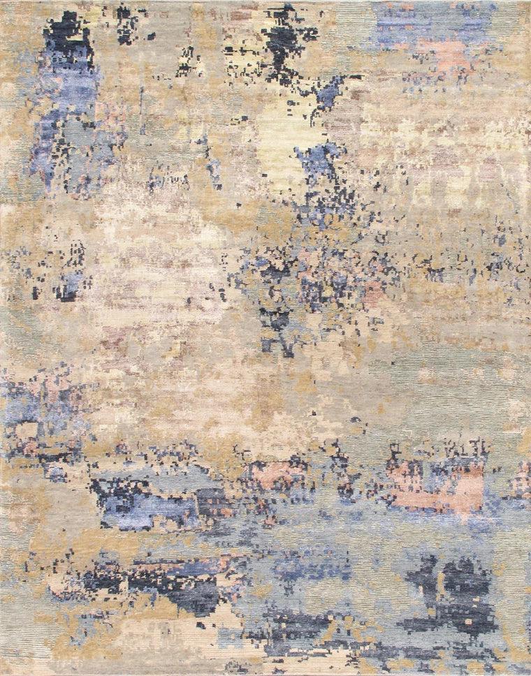 Abstract patterned rug with blue, beige, and gray colors