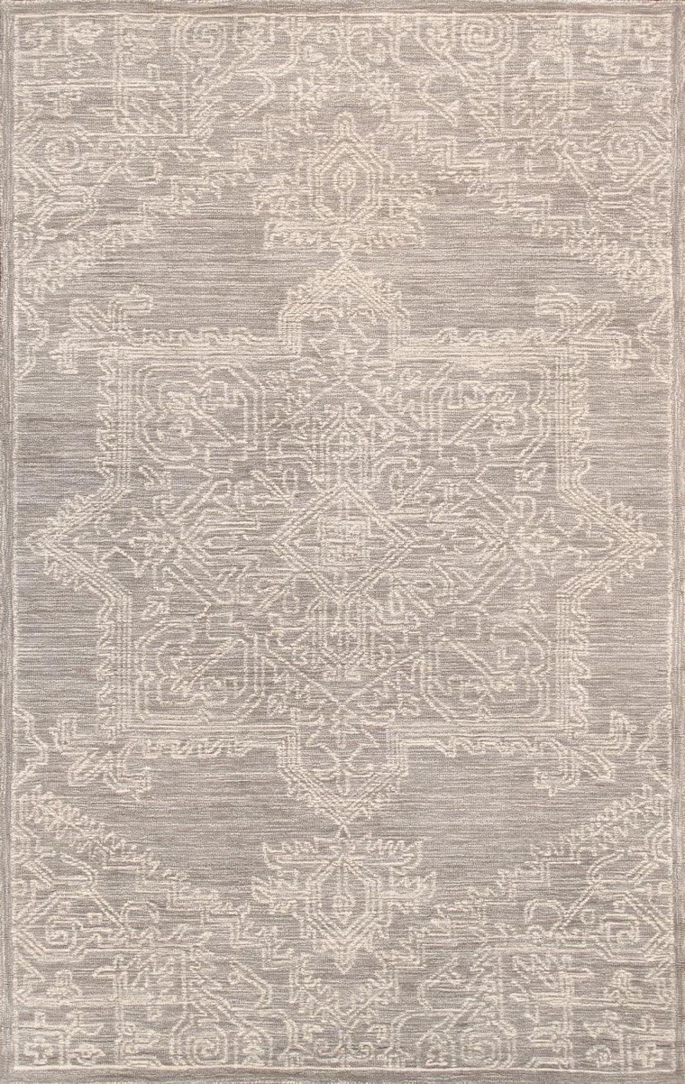 Decorative rug with geometric pattern in gray and beige tones