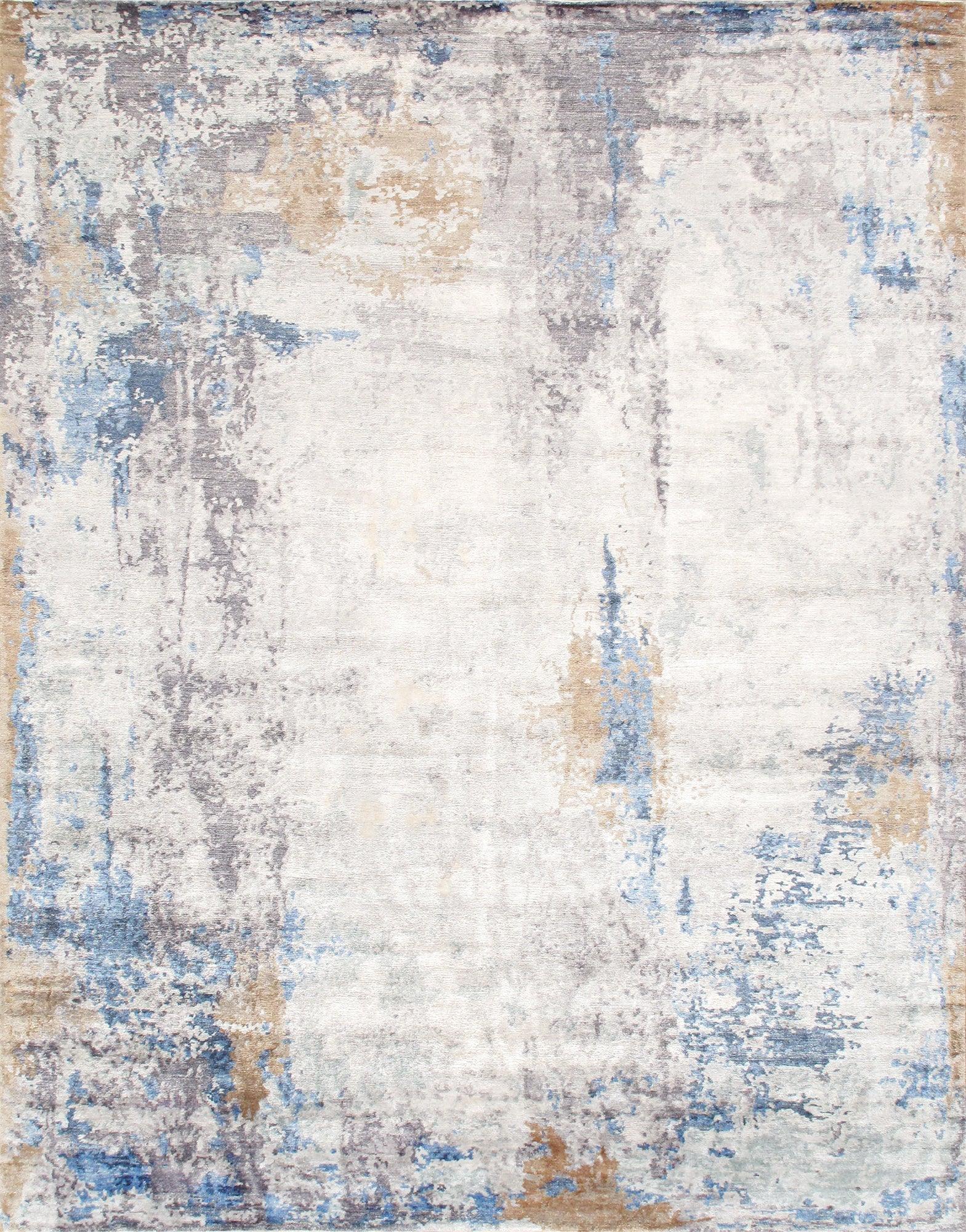 Abstract patterned rug with blue, beige, and gray colors on a white background