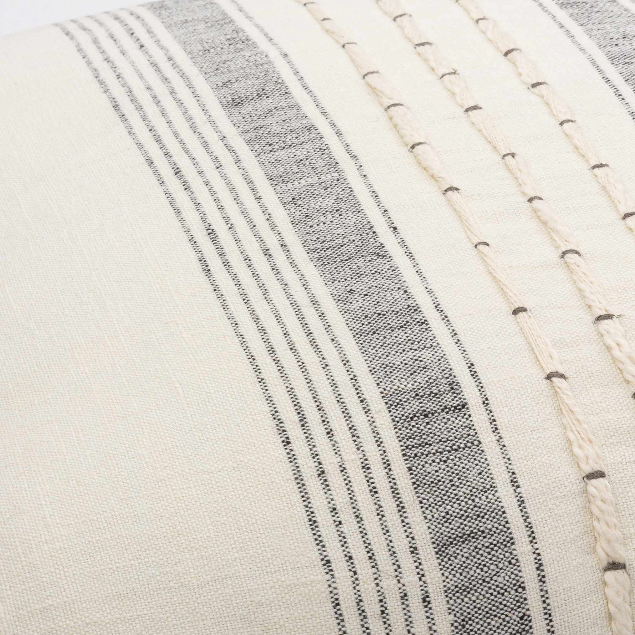 Close-up of a textured fabric with horizontal stripes in gray and beige.
