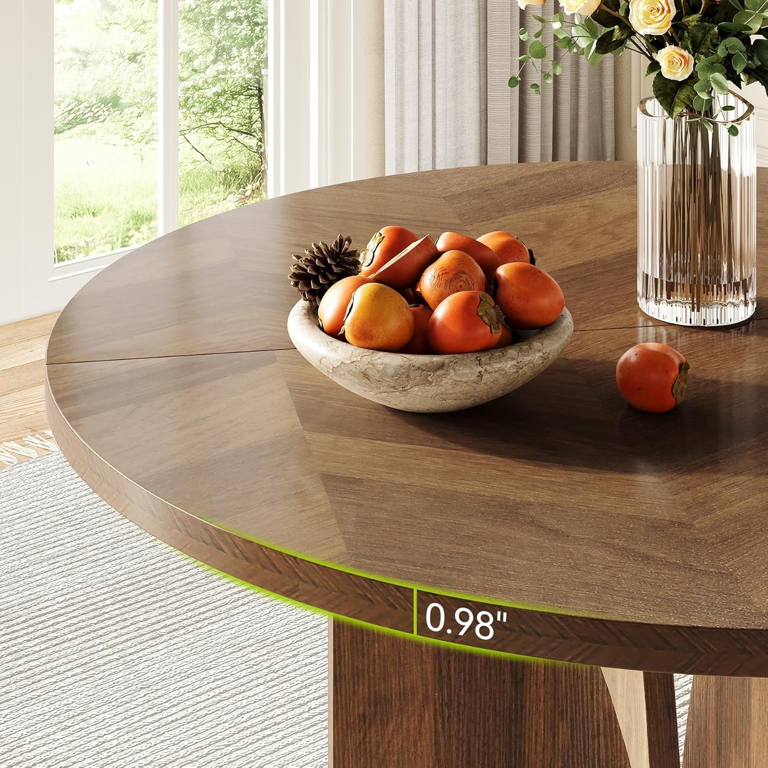 Wooden table with a bowl of fruits and a vase in a bright room